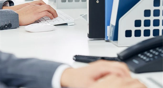 Engineers reviewing quality control specs for industrial automotive filtration