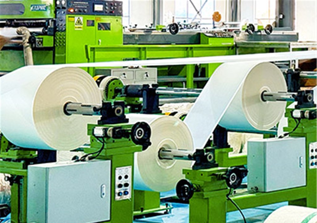 High-speed industrial paper slitting and coating machinery inside the Greenlano factory
